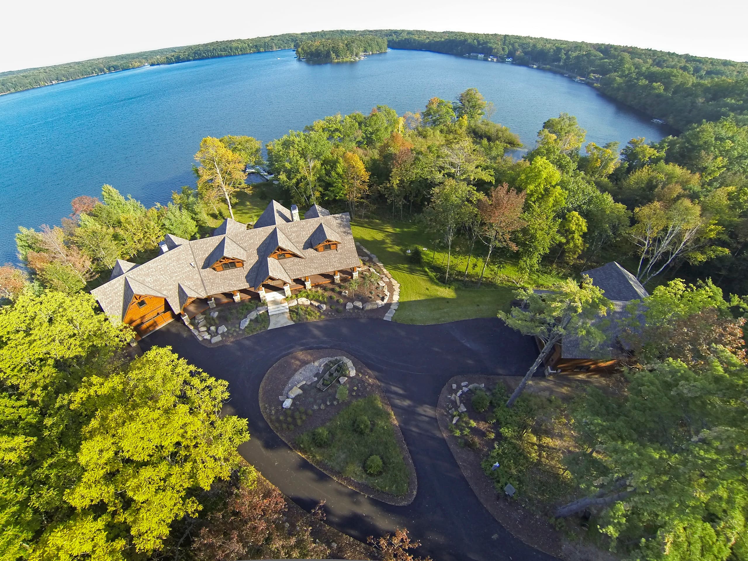 Aerial view of lakeside estate with full landscape design
