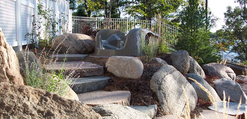 Large boulder steps installed on lakeside property