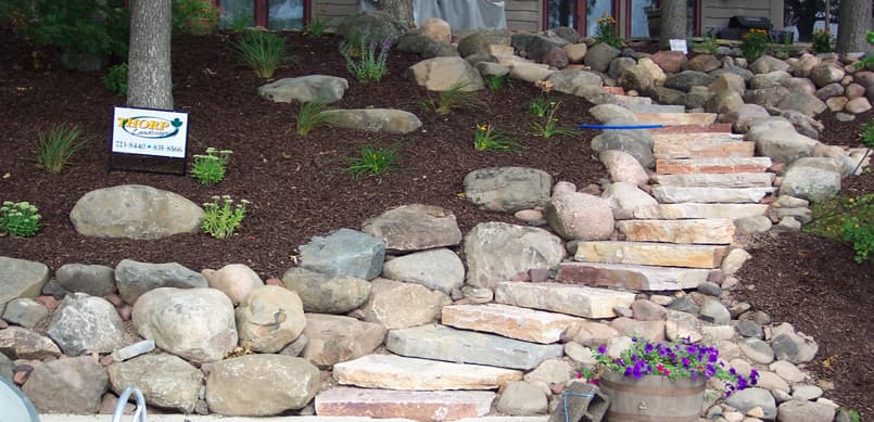 Boulder steps and path leading down to waterfront
