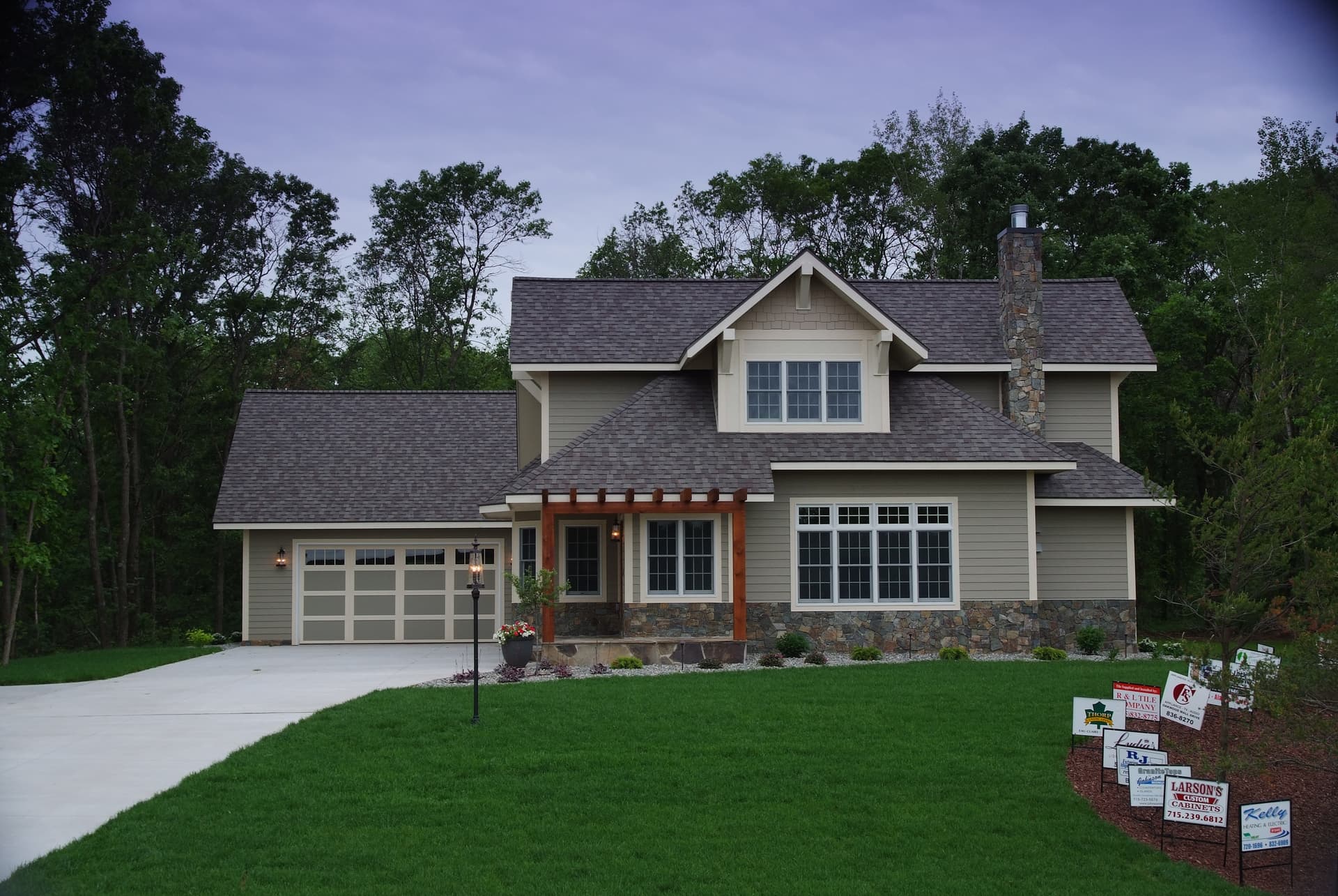 Craftsman home with full landscape design and stone accent walls